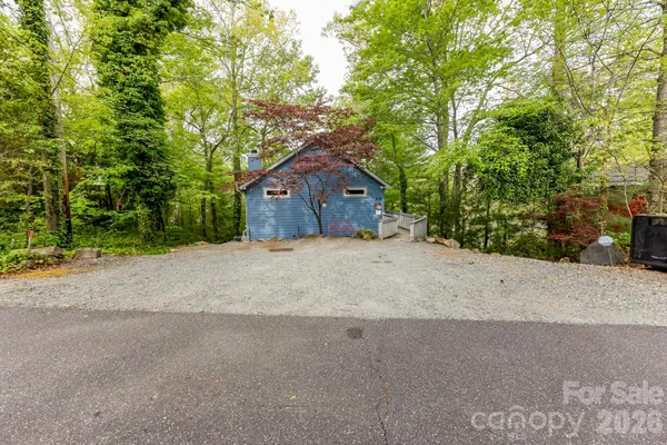 a house with a tree in front of it