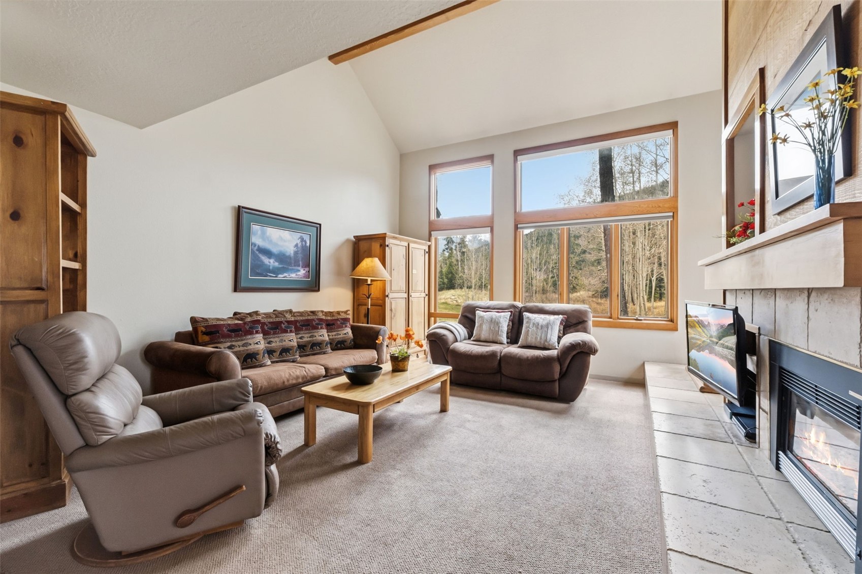 30 Tennis Club Road, Unit 1608 Keystone, CO 80435 - Photo 3 of 29 a living room with fireplace furniture and a large window