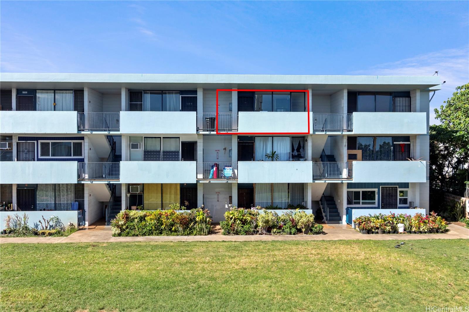 94-249 Waikele Road, Unit A307 Waipahu, HI 96797 - Photo 12 of 20 a front view of a building with a yard