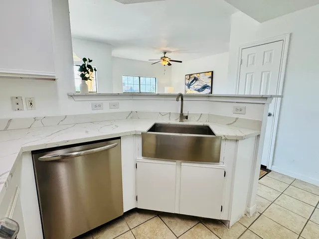 a kitchen with stainless steel appliances a refrigerator stove and sink