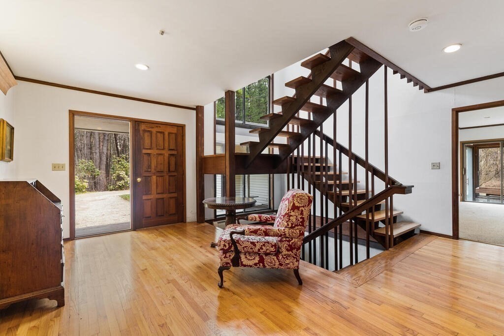 15 Spring Hill Road Acton, MA 01720 - Photo 3 of 22 a view of an empty room with wooden floor and furniture