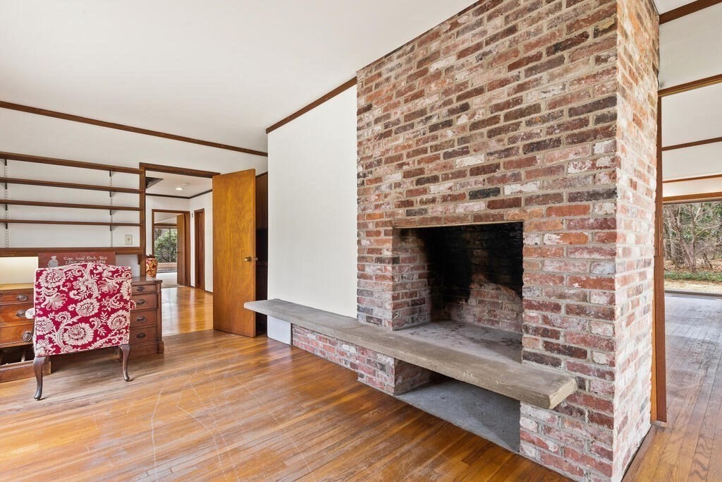 15 Spring Hill Road Acton, MA 01720 - Photo 6 of 22 a living room with stainless steel appliances kitchen island granite countertop furniture and a fireplace