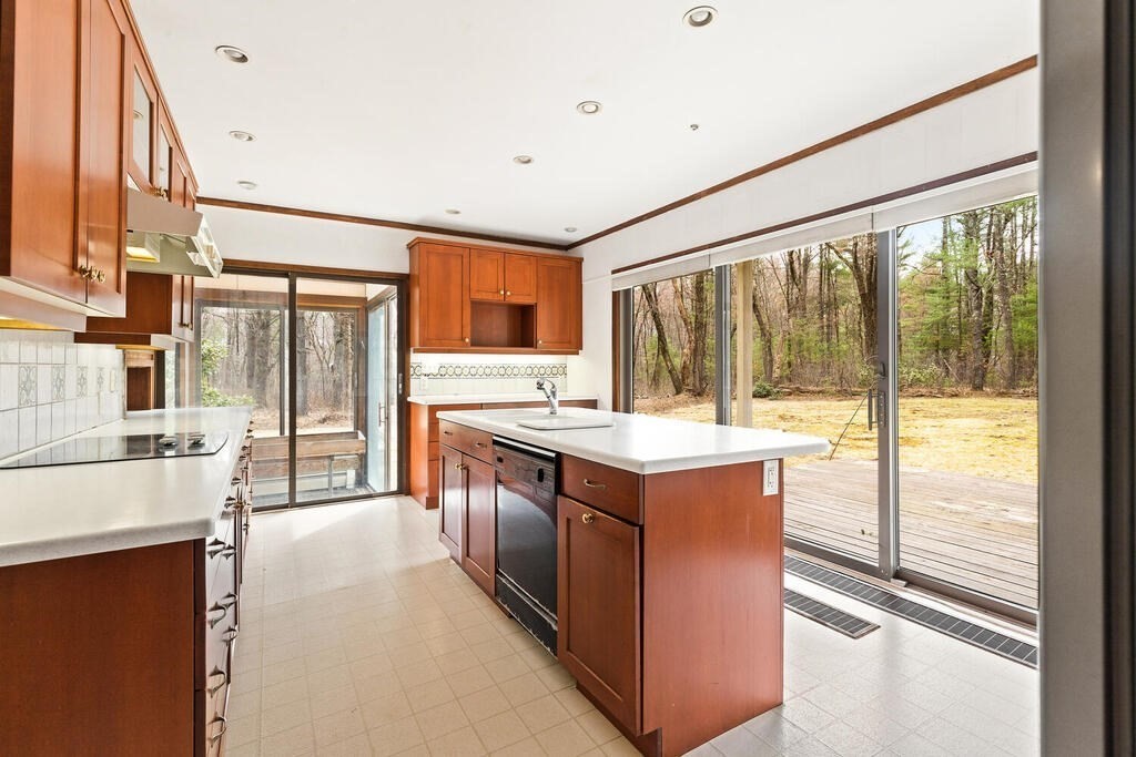 15 Spring Hill Road Acton, MA 01720 - Photo 7 of 22 a large kitchen with stainless steel appliances granite countertop a sink and a large window