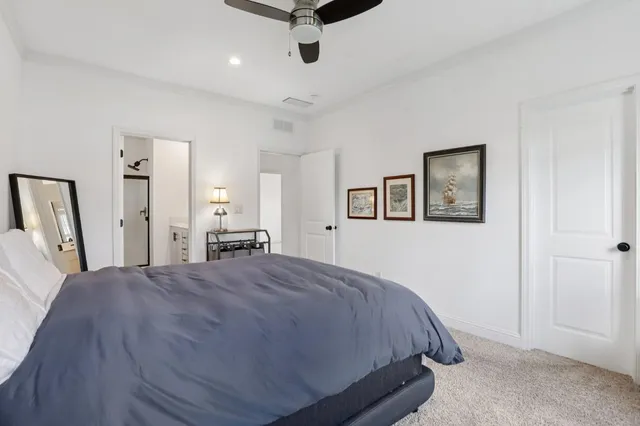 a bed room with a bed and a tv