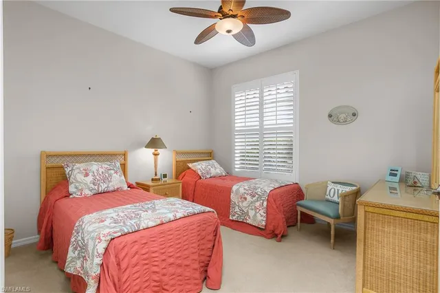 a bedroom with bed and window