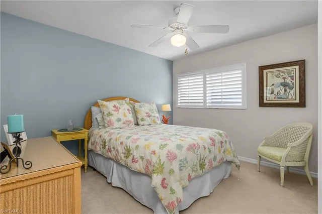 a bedroom with a bed and a chair