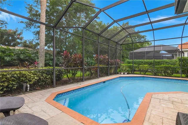 a view of a backyard with sitting area