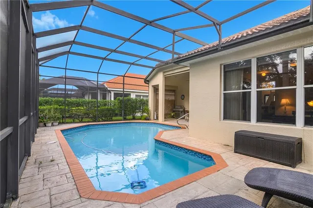 a view of a patio with swimming pool table and chairs