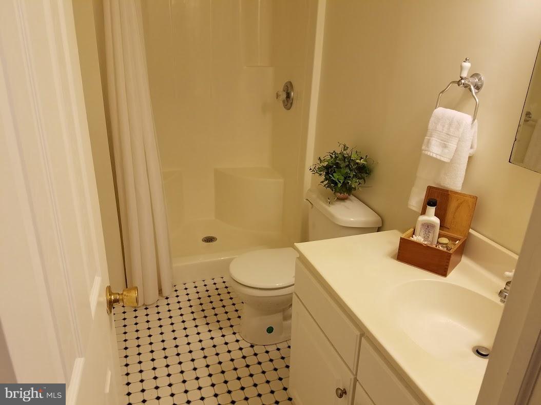 13612 Coppermine Road Union Bridge, MD 21791 - Photo 11 of 15 a bathroom with a sink toilet and shower