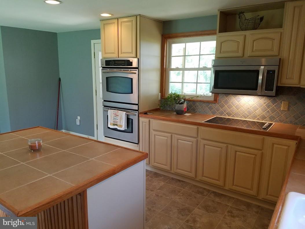 13612 Coppermine Road Union Bridge, MD 21791 - Photo 7 of 15 a kitchen with sink cabinets and window