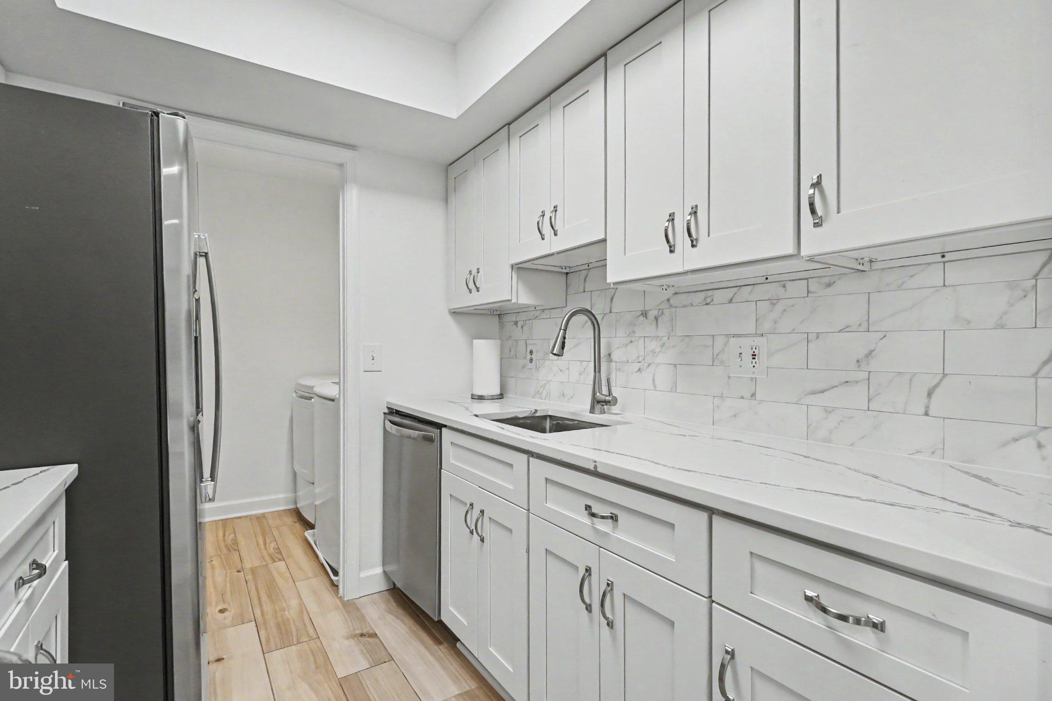 14800 Rydell Road, Unit 201 Centreville, VA 20121 - Photo 8 of 28 Sleek modern kitchen with elegant finishes.