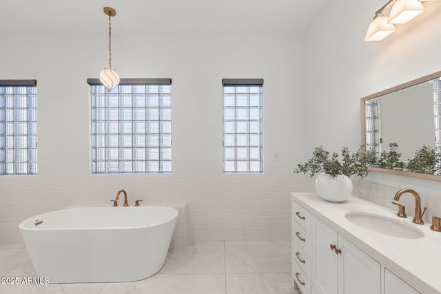 a bathroom with a sink and a bathtub
