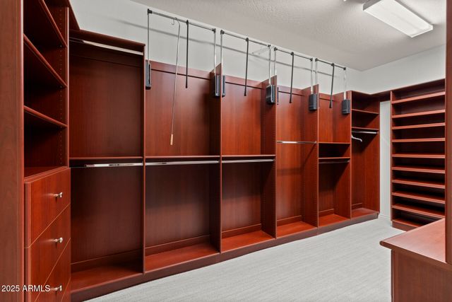 a bedroom with bed and a window