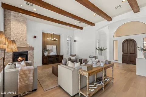 a living room with fireplace furniture and a fireplace