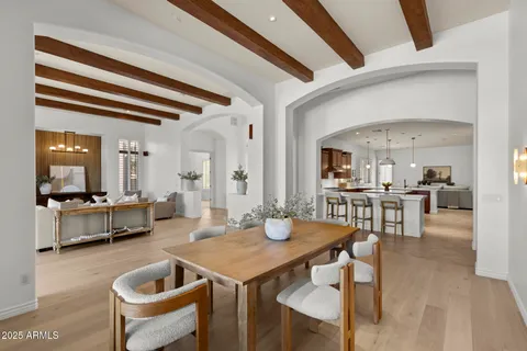 a living room with furniture and view of kitchen