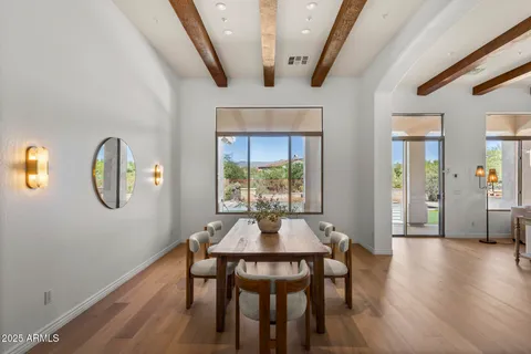 a dining room with furniture and window