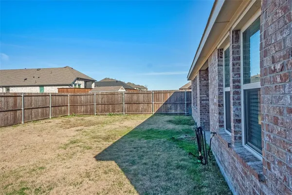 a view of a backyard with a deck