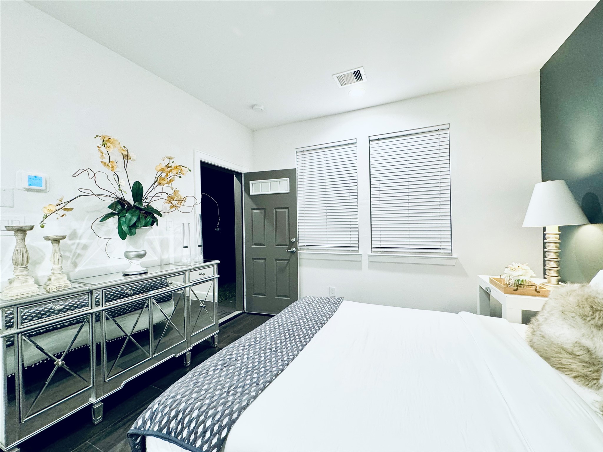 2717 Clinton Drive Houston, TX 77020 - Photo 17 of 22 a bedroom with a bed and a potted plant