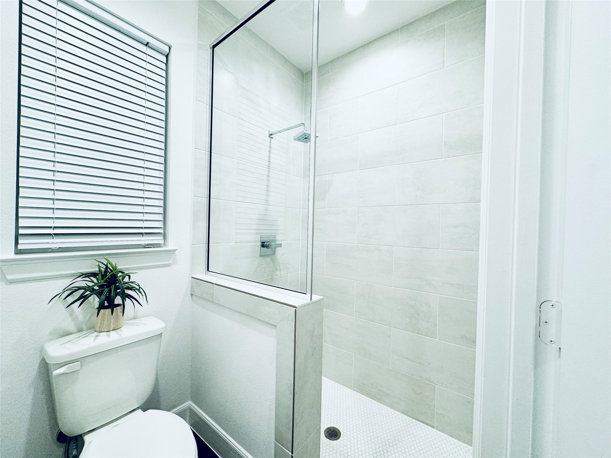 2717 Clinton Drive Houston, TX 77020 - Photo 19 of 22 a white toilet next to a bathroom