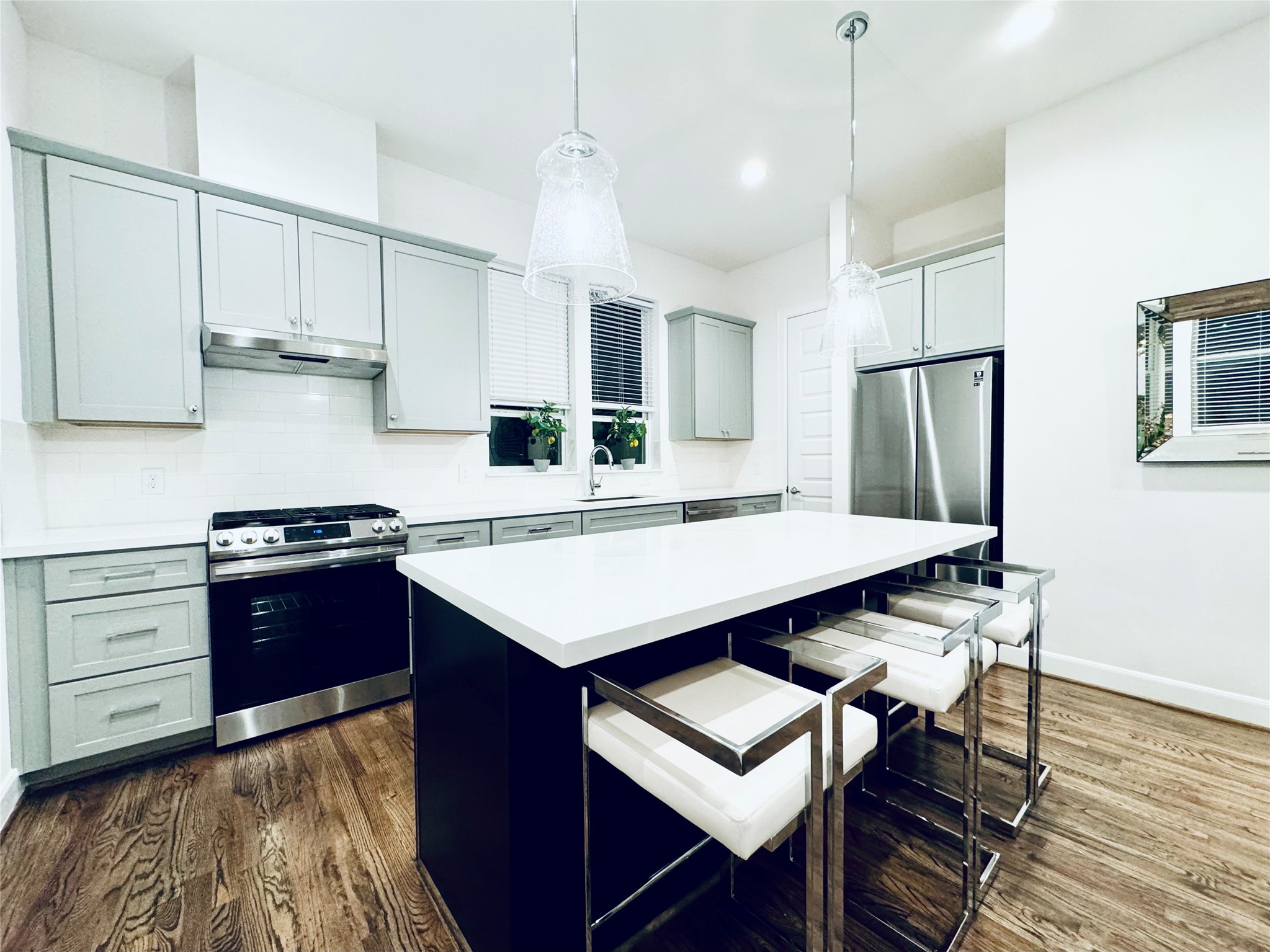 2717 Clinton Drive Houston, TX 77020 - Photo 5 of 22 a kitchen with stainless steel appliances granite countertop a sink stove and refrigerator