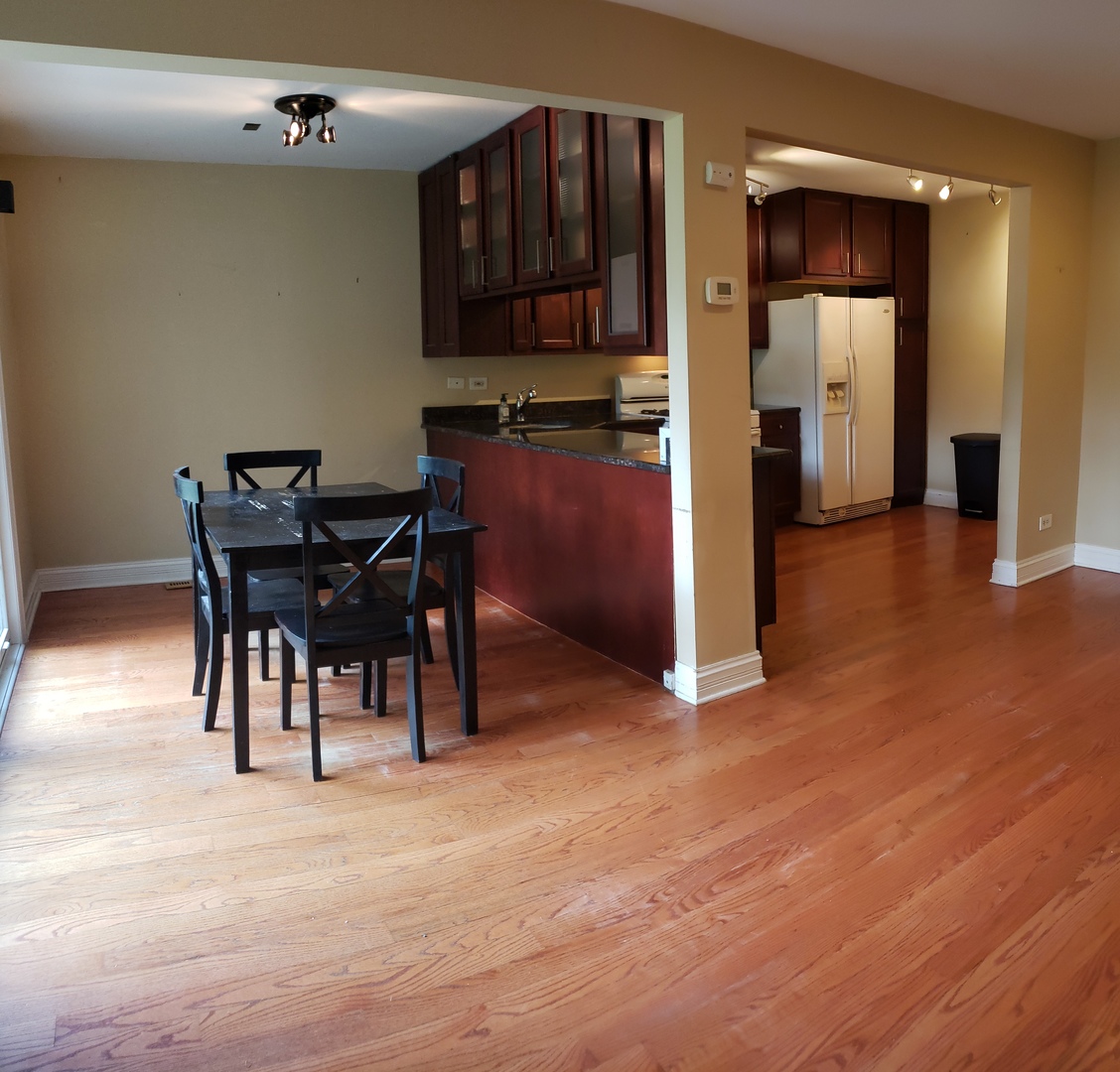 1150 Mt Vernon Court, Unit C Wheaton, IL 60189 - Photo 20 of 21 a view of a dining room with furniture