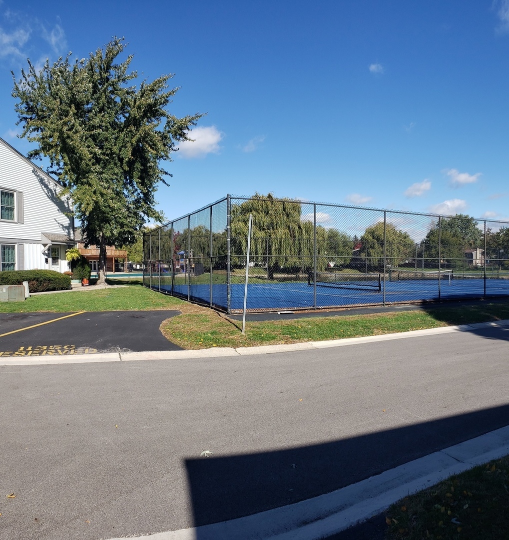 1150 Mt Vernon Court, Unit C Wheaton, IL 60189 - Photo 5 of 21 a view of a swimming pool with an outdoor space and seating area