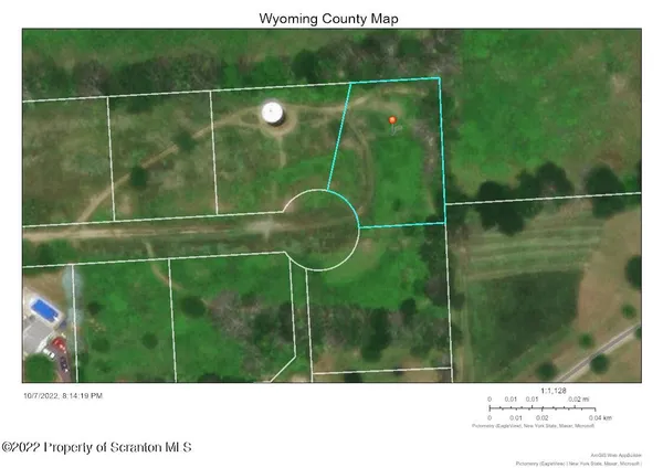 a bathroom with a shower and a sink