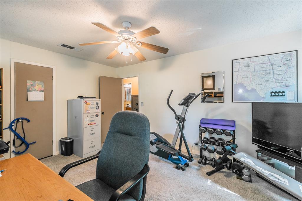 1055 Miller Road Azle, TX 76020 - Photo 21 of 40 Bedroom 2 with a ceiling fan and baseboards