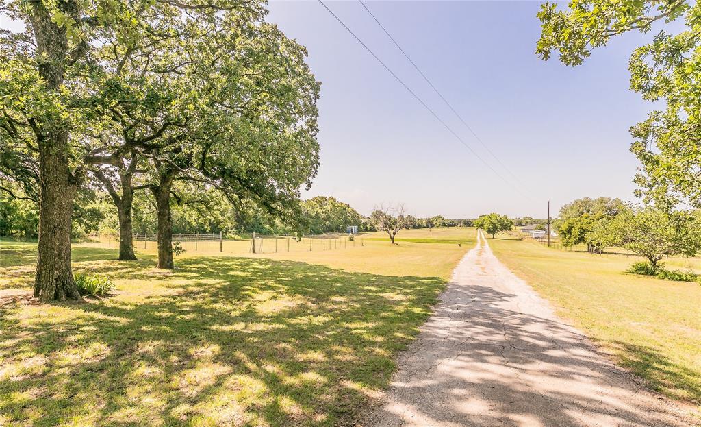 1055 Miller Road Azle, TX 76020 - Photo 31 of 40 View down gravel drive from pool shed area.