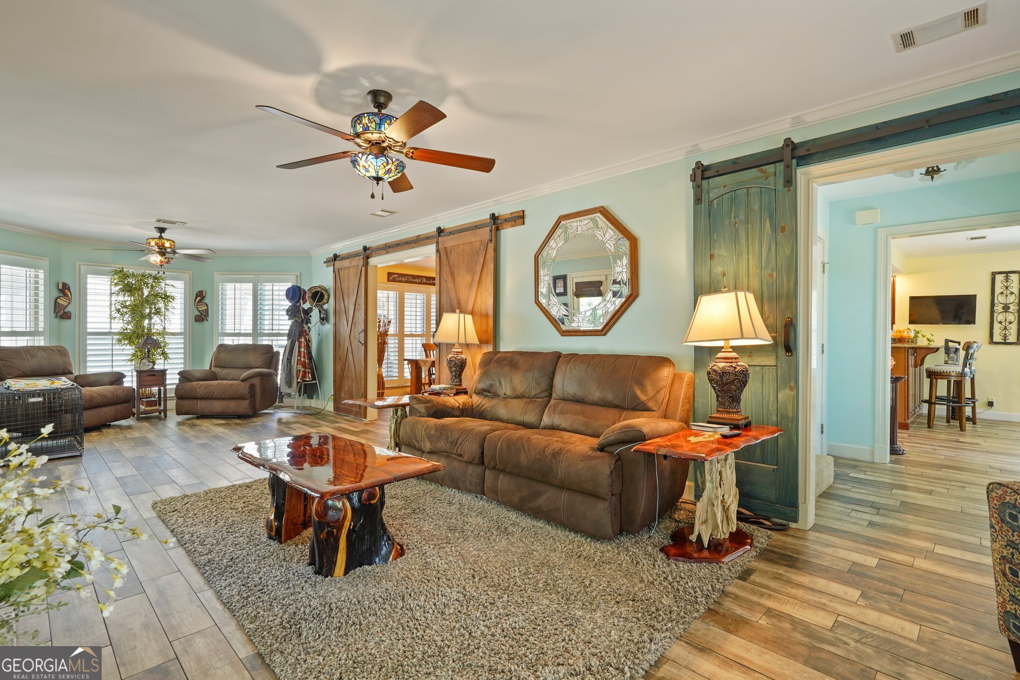 600 Shore Edge Trc St. Simons Island, GA 31522 - Photo 26 of 93 a living room with furniture a clock on wall and a window