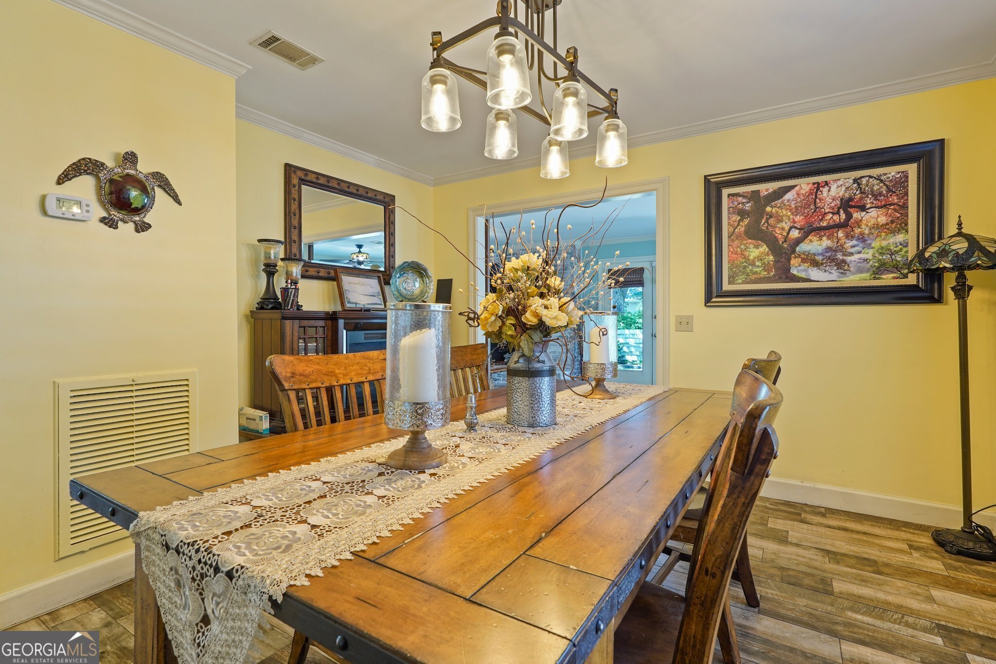 600 Shore Edge Trc St. Simons Island, GA 31522 - Photo 28 of 93 a dining room with furniture and wooden floor