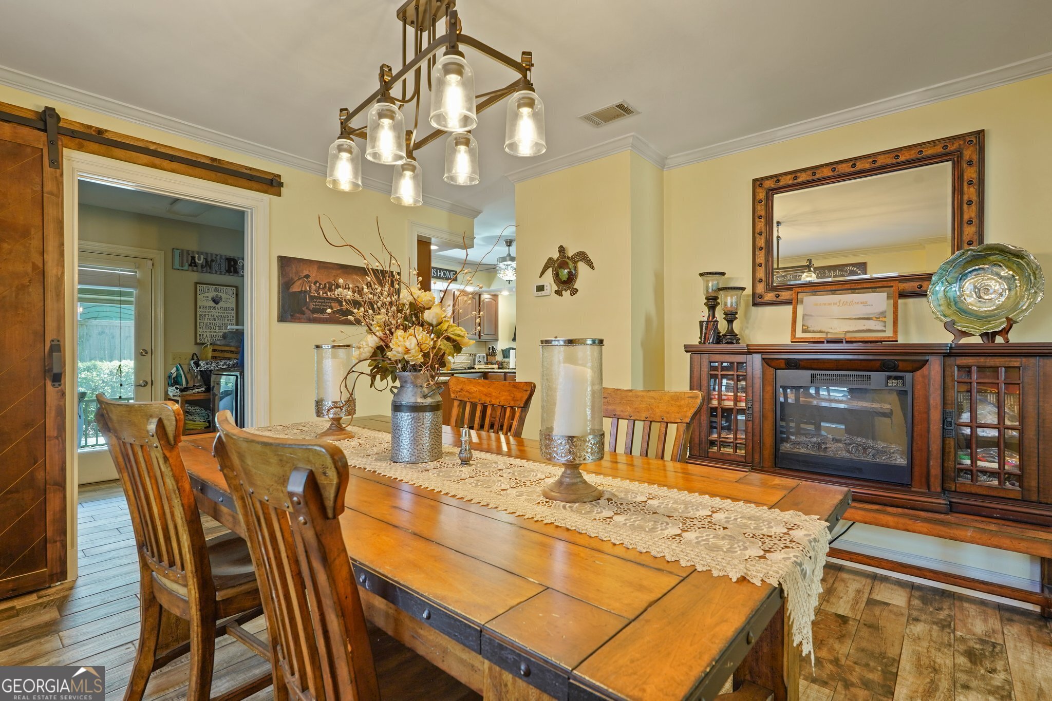 600 Shore Edge Trc St. Simons Island, GA 31522 - Photo 29 of 93 a view of a dining room with furniture and wooden floor