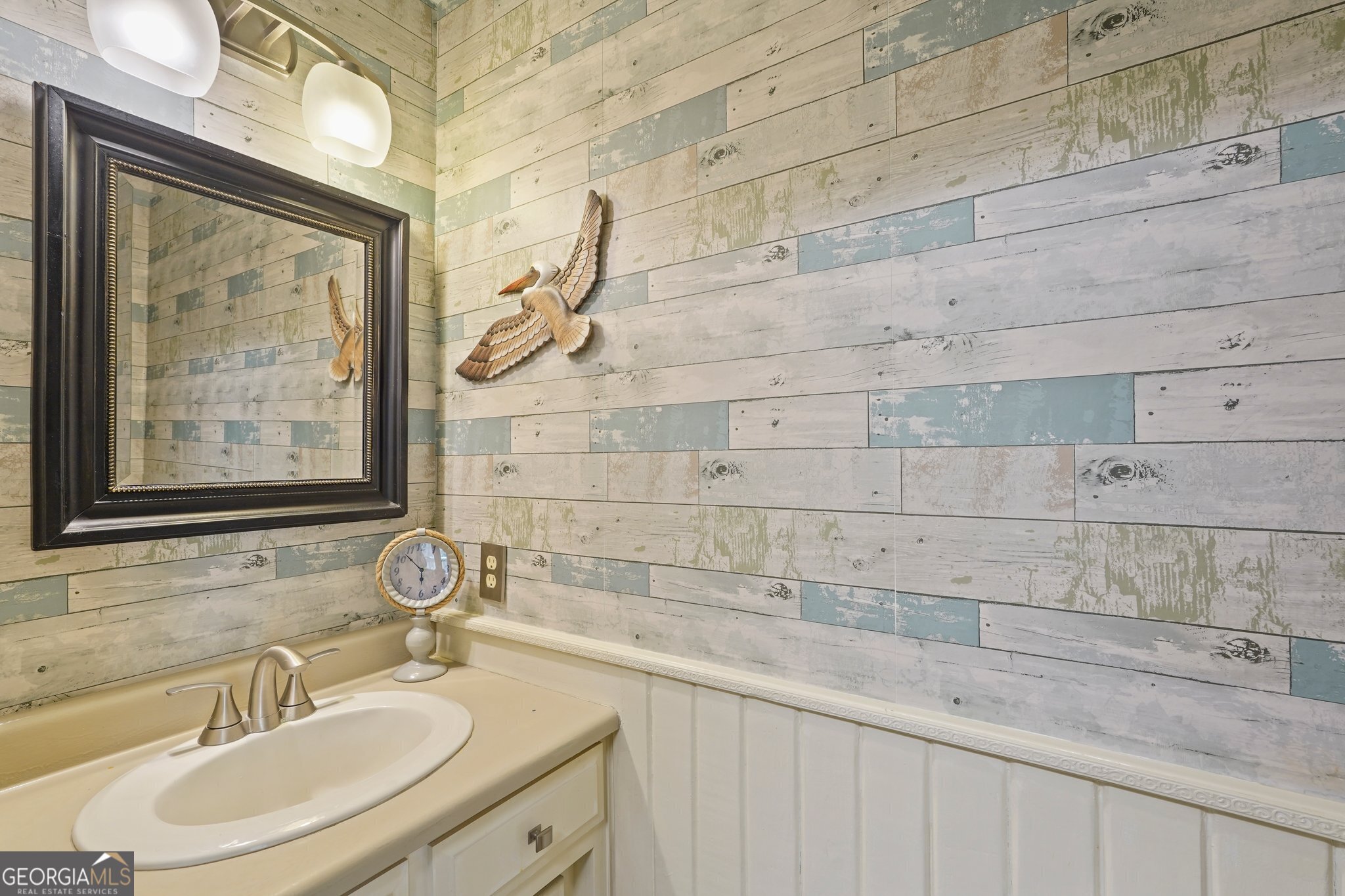 600 Shore Edge Trc St. Simons Island, GA 31522 - Photo 31 of 93 a bathroom with a sink and a mirror