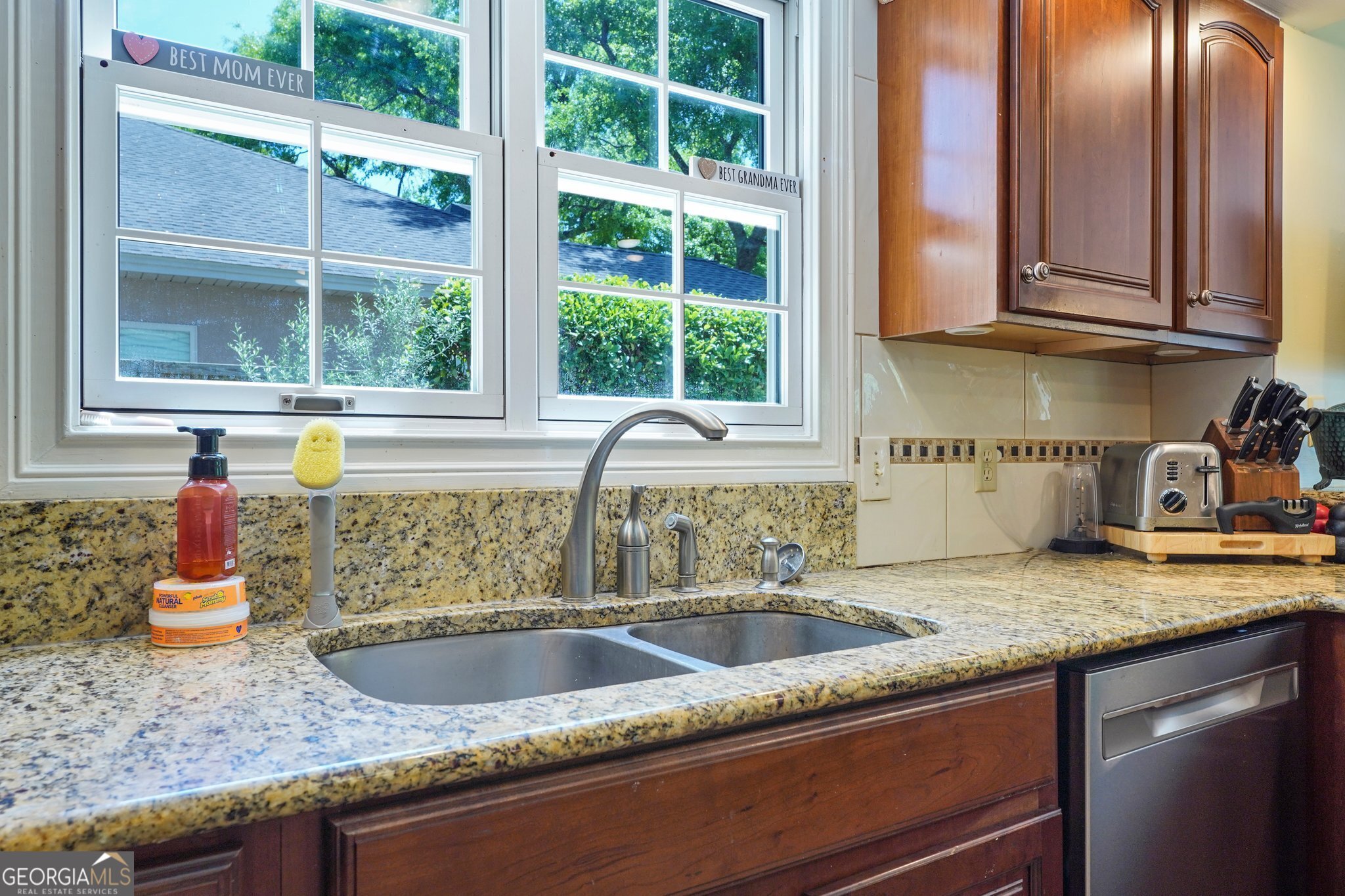 600 Shore Edge Trc St. Simons Island, GA 31522 - Photo 43 of 93 a kitchen with granite countertop a sink and a window