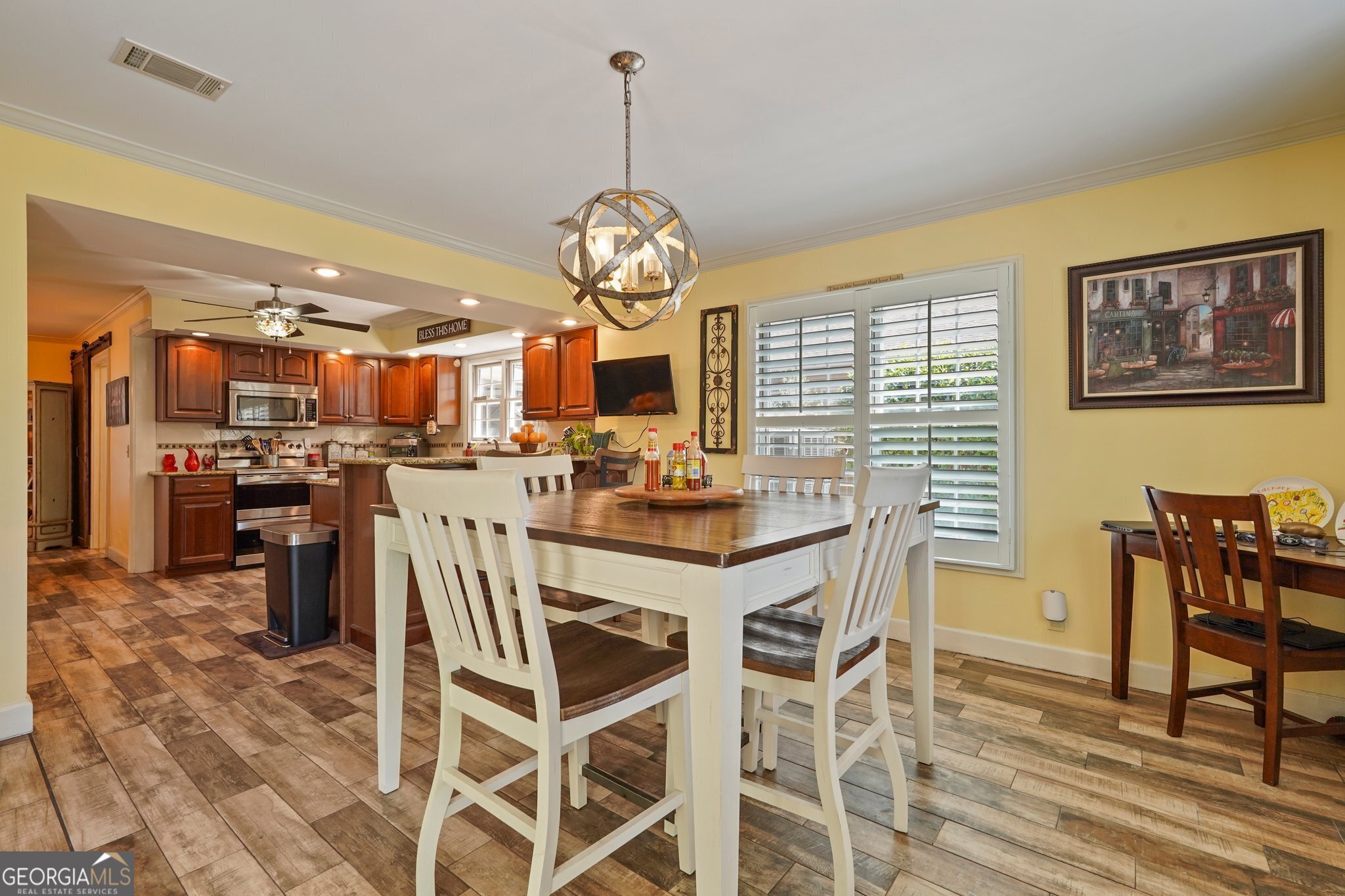 600 Shore Edge Trc St. Simons Island, GA 31522 - Photo 46 of 93 a view of a dining room with furniture wooden floor and chandelier