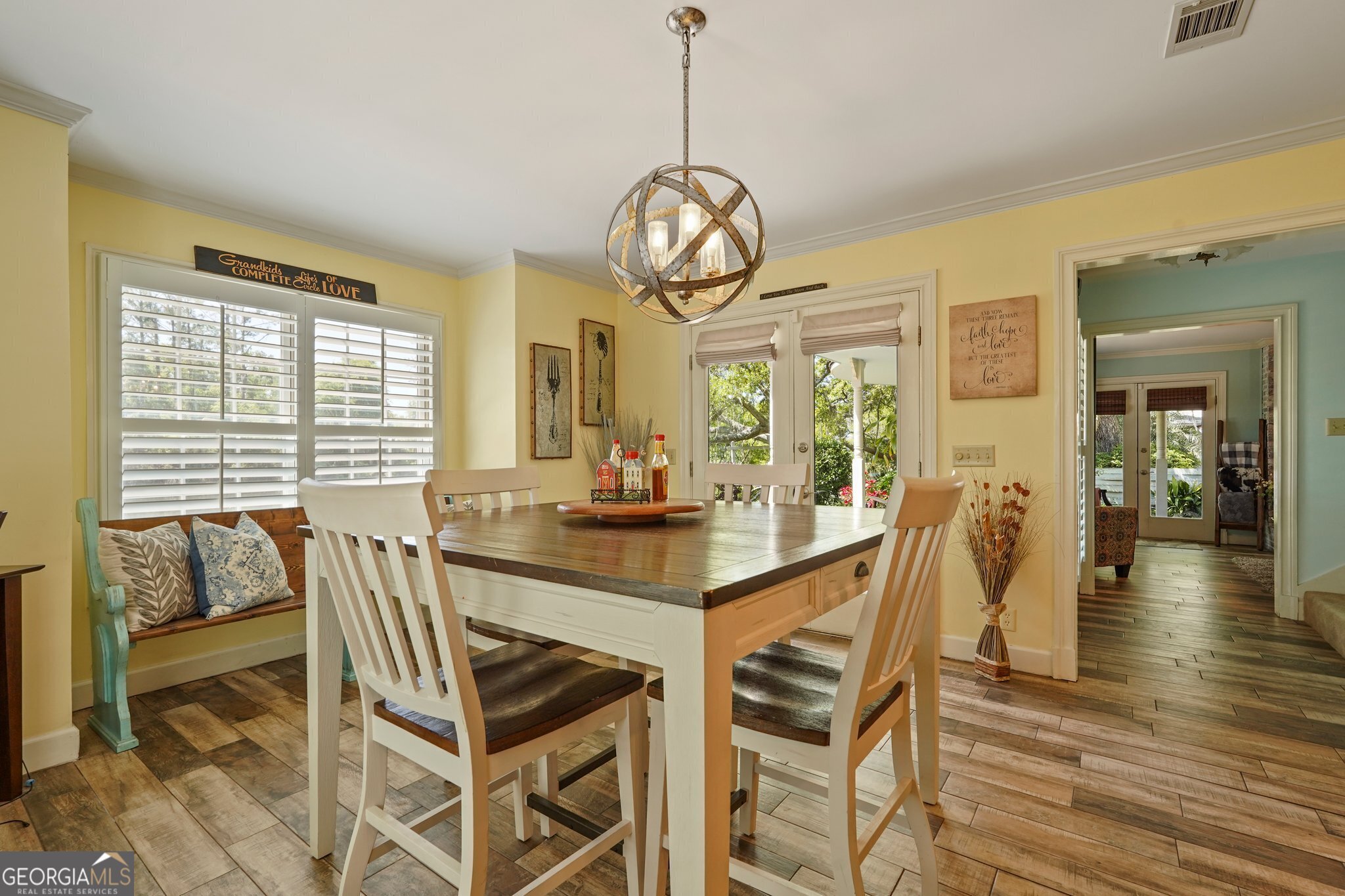 600 Shore Edge Trc St. Simons Island, GA 31522 - Photo 48 of 93 a view of a dining room with furniture wooden floor and a chandelier