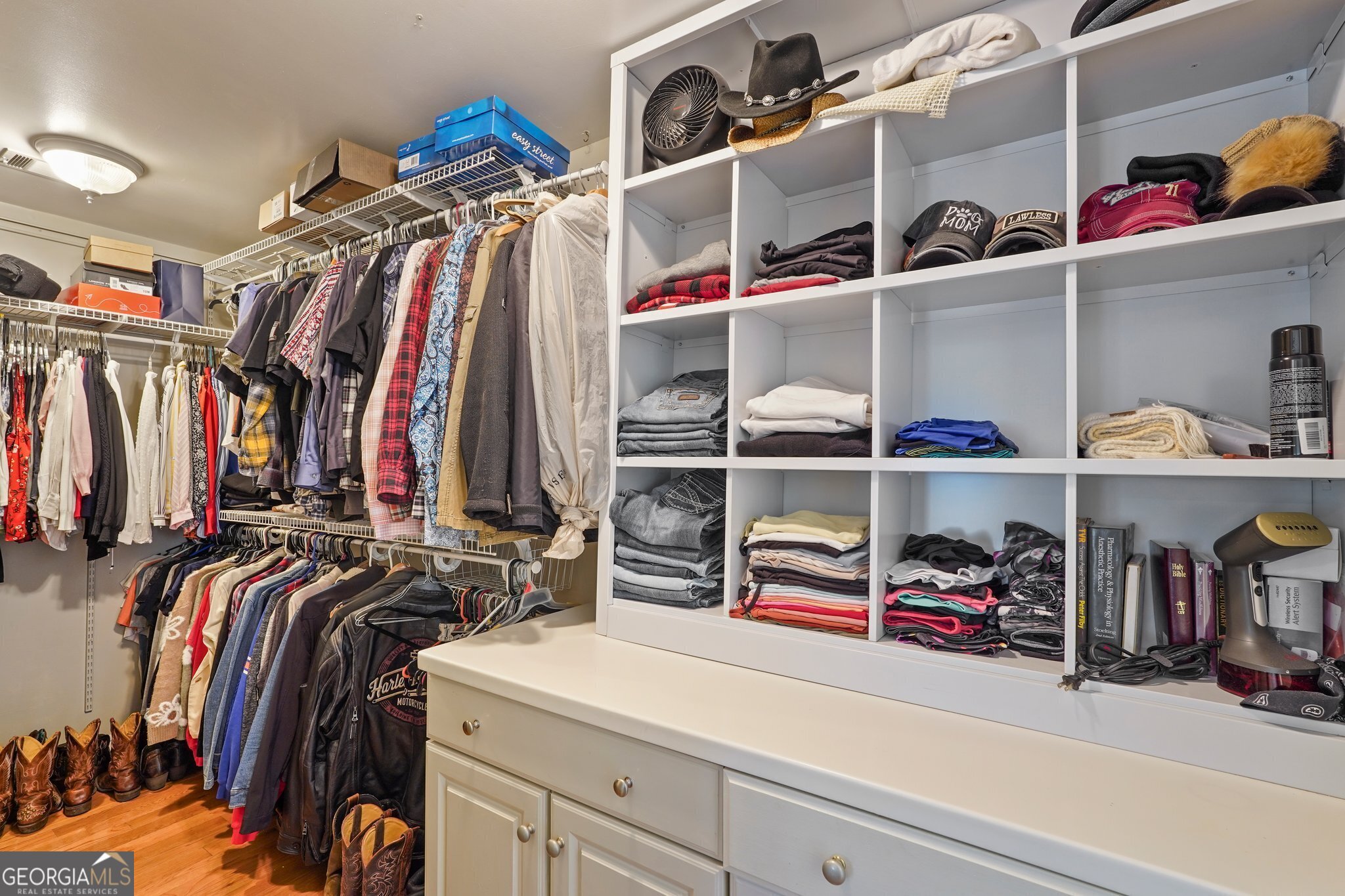 600 Shore Edge Trc St. Simons Island, GA 31522 - Photo 55 of 93 a view of walk in closet with clothes and shoes