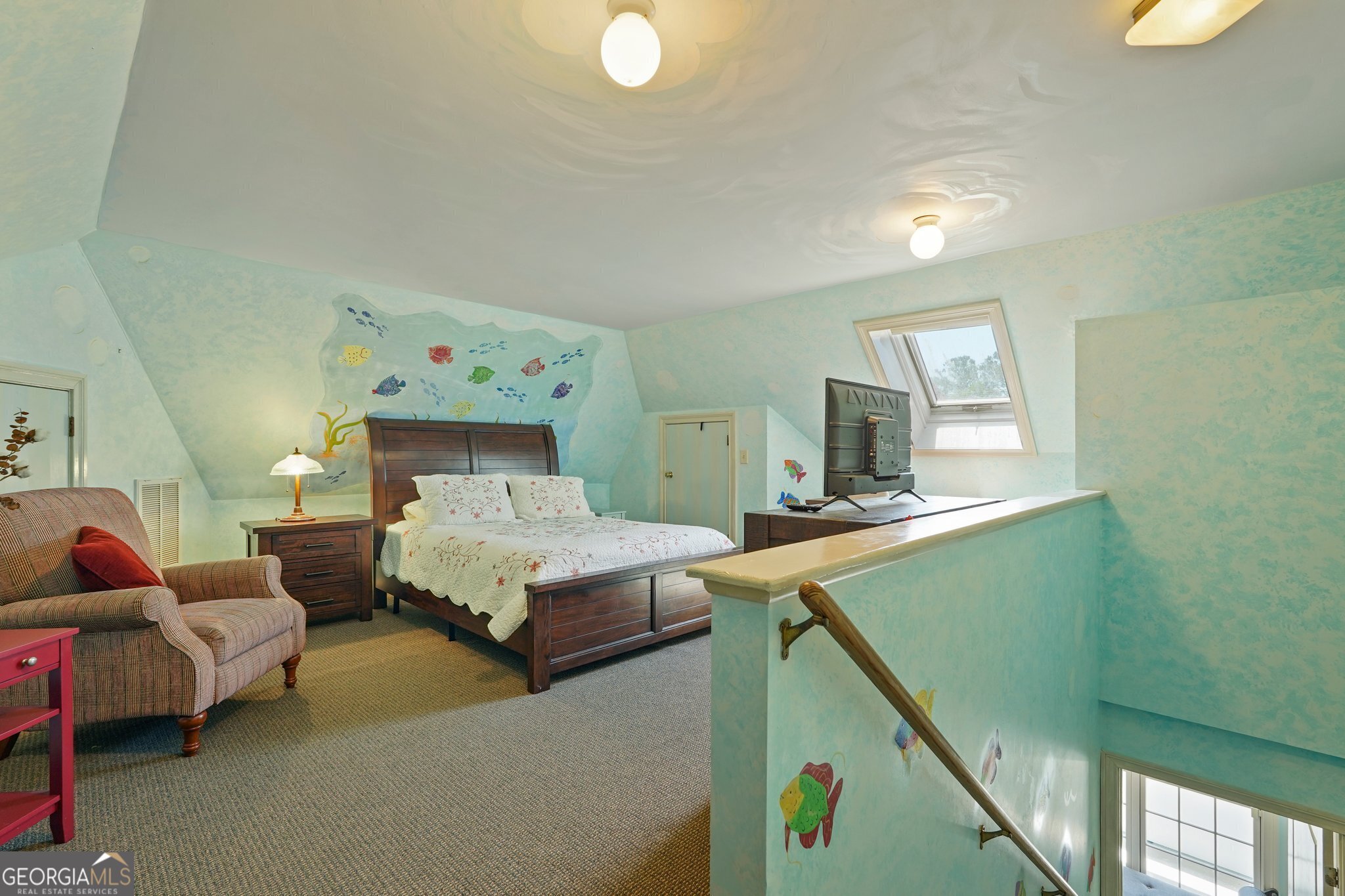 600 Shore Edge Trc St. Simons Island, GA 31522 - Photo 72 of 93 a bedroom with a bed and a couch