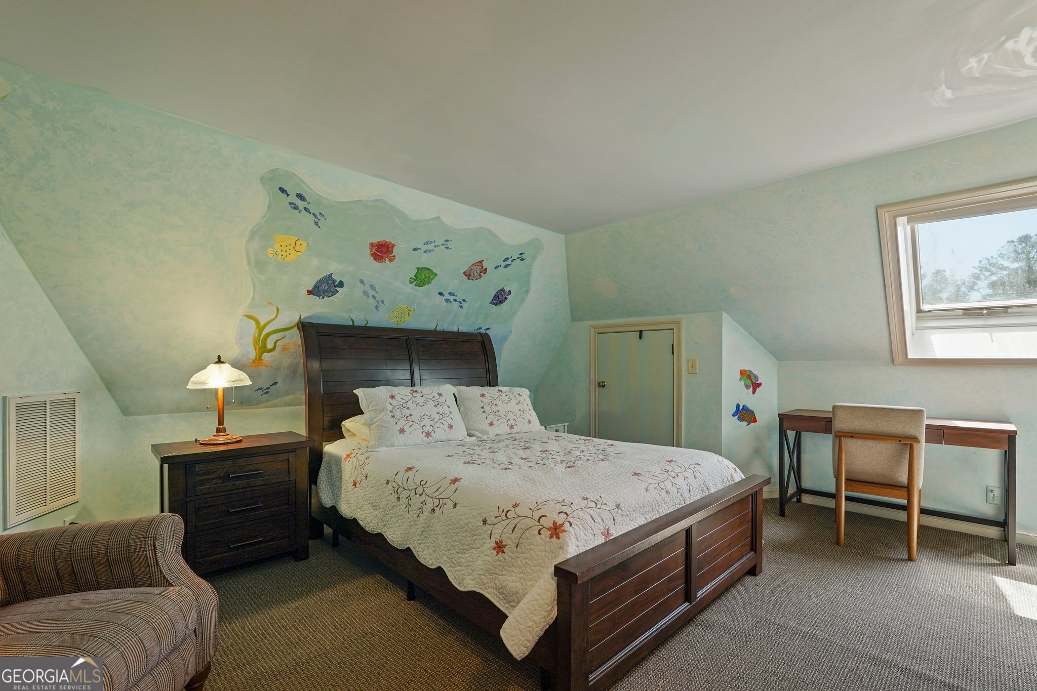 600 Shore Edge Trc St. Simons Island, GA 31522 - Photo 73 of 93 a bedroom with a bed and a table in it