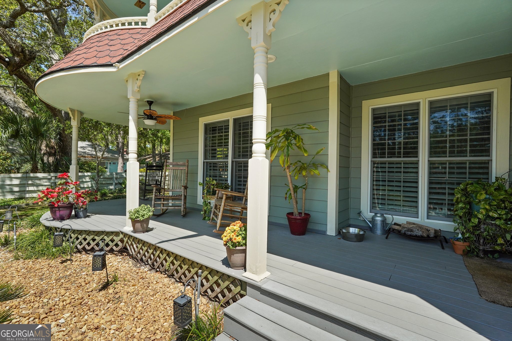 600 Shore Edge Trc St. Simons Island, GA 31522 - Photo 8 of 93 a view of a patio with table and chairs and potted plants