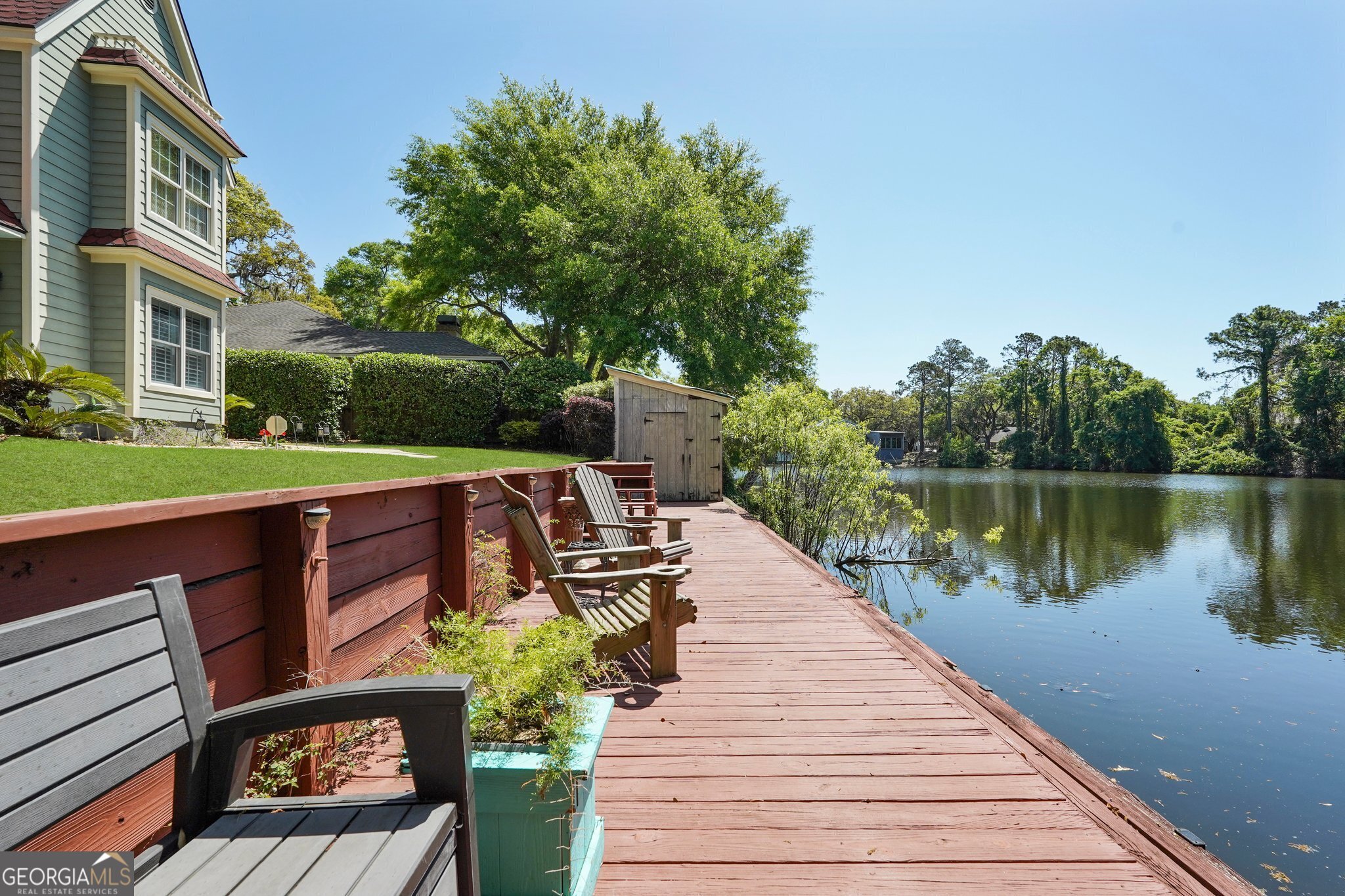 600 Shore Edge Trc St. Simons Island, GA 31522 - Photo 87 of 93 a view of a wooden deck with furniture