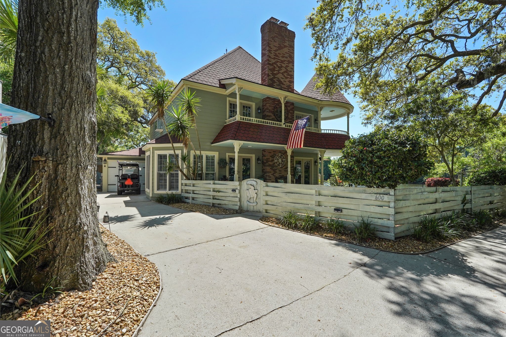600 Shore Edge Trc St. Simons Island, GA 31522 - Photo 91 of 93 a front view of a house with a yard