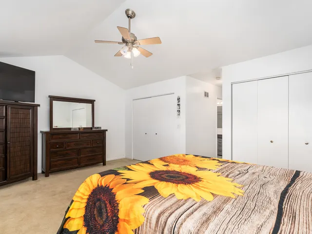 a bedroom with a bed and a dresser