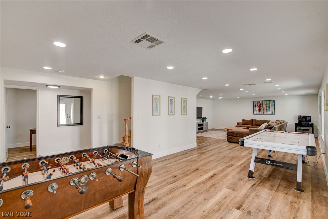 4362 Thistle Street Logandale, NV 89021 - Photo 42 of 99 Ample lighting and LVP surface flooring define this spacious recreation room, ready for entertainment.