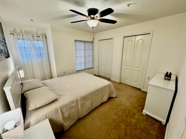 9430 Ivy Brook Run, Unit 403 Fort Myers, FL 33913 - Photo 11 of 25 a bed room with a bed and a ceiling fan