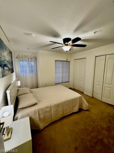 9430 Ivy Brook Run, Unit 403 Fort Myers, FL 33913 - Photo 12 of 25 a bed room with a bed and a ceiling fan