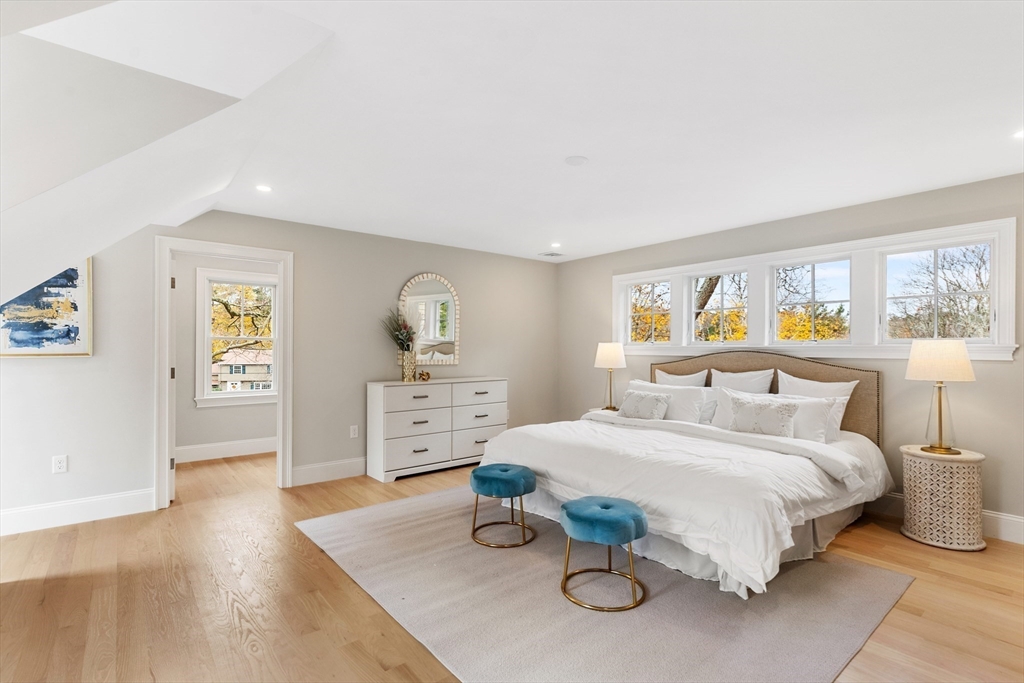 6 Revolutionary Road Lexington, MA 02421 - Photo 12 of 23 a bedroom with a bed and wooden floor