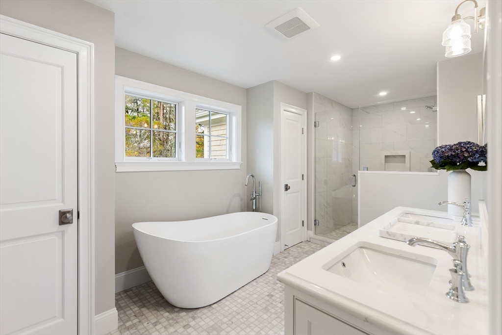 6 Revolutionary Road Lexington, MA 02421 - Photo 13 of 23 a bathroom with a bathtub and a sink