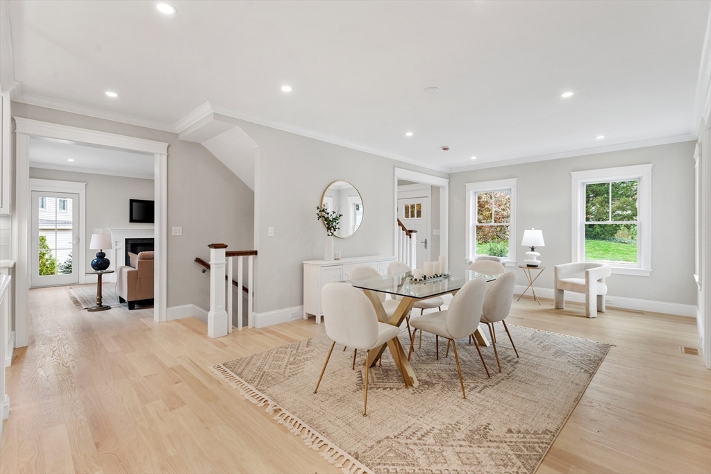 6 Revolutionary Road Lexington, MA 02421 - Photo 6 of 23 a dining room with wooden floor and a rug