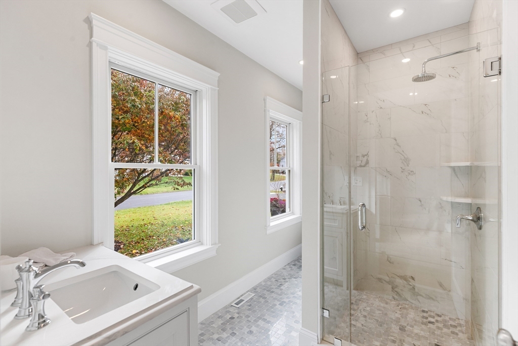 6 Revolutionary Road Lexington, MA 02421 - Photo 10 of 23 a bathroom with a sink a toilet and shower